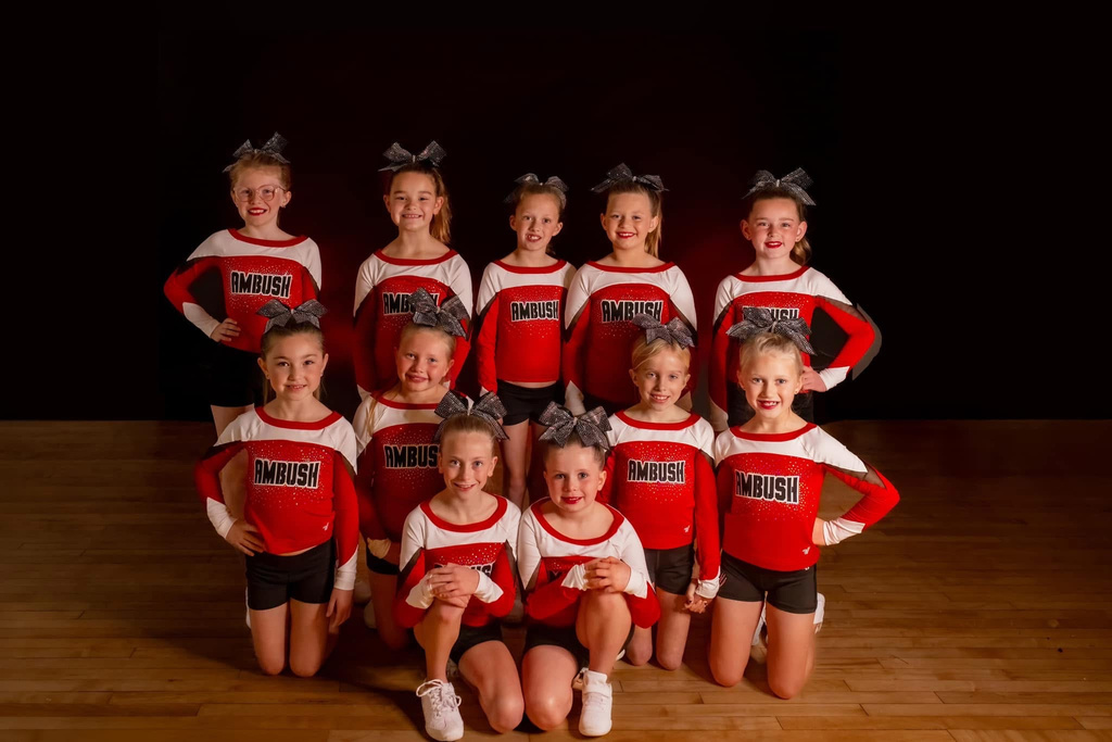 Iowa Ambush Cheer competition team in red and white uniforms